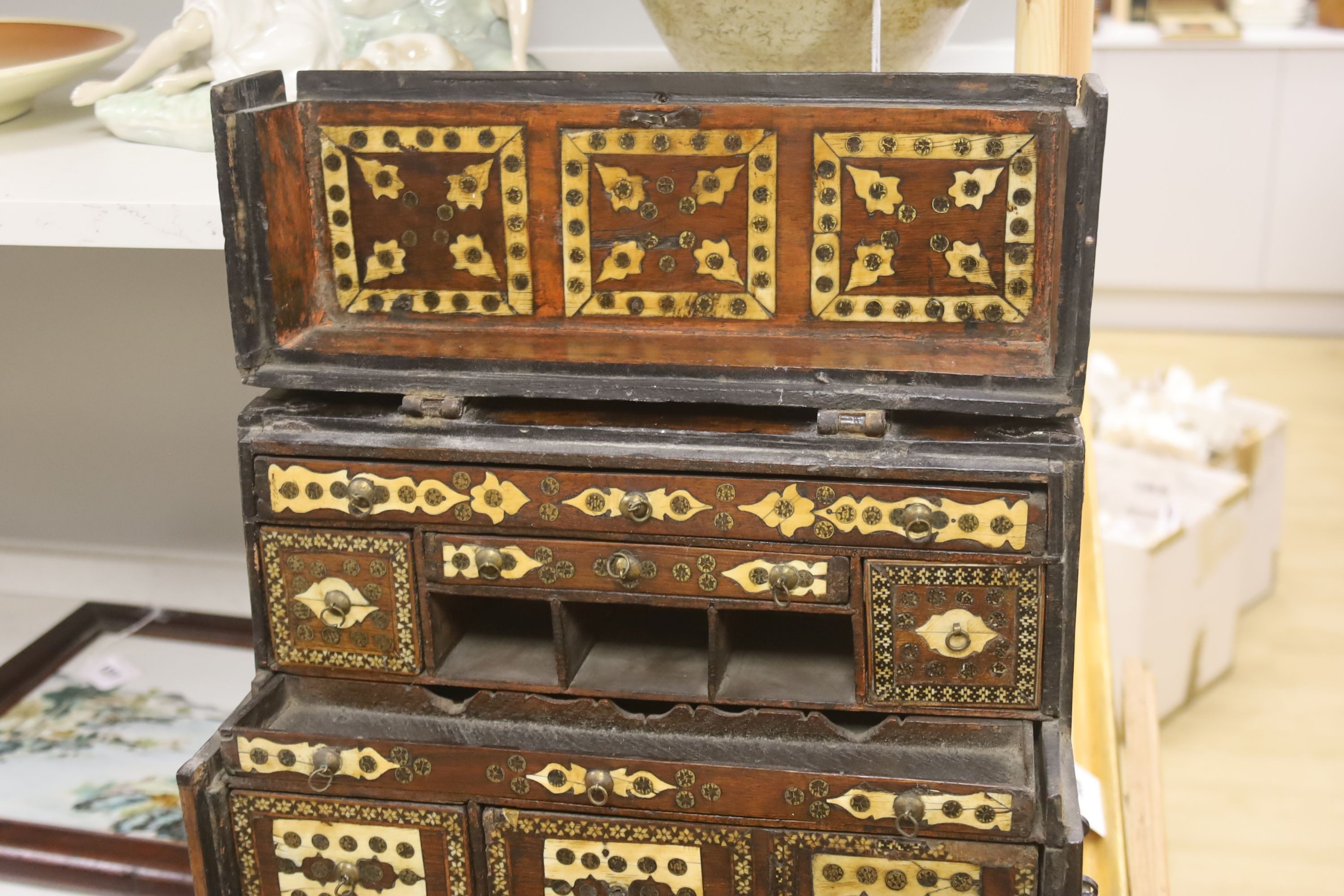 A 17th century Hispano Moresque bone inlaid walnut table cabinet 40cm